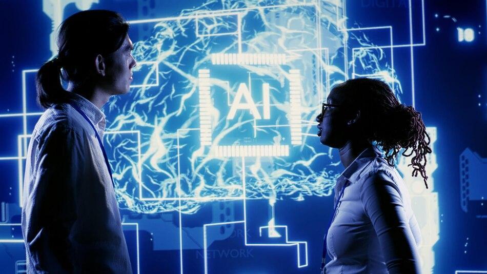 two people observing AI and network graphics on a digital interface